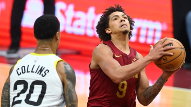 Dec 20, 2023; Cleveland, Ohio, USA; Cleveland Cavaliers guard Craig Porter (9) drives to the basket as Utah Jazz forward John Collins (20) defends in the second quarter at Rocket Mortgage FieldHouse. 